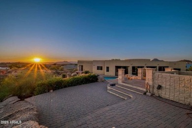 The Belgard pavers of the circular driveway lead up to this on Troon North Golf Club  in Arizona - for sale on GolfHomes.com, golf home, golf lot