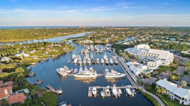 Experience the epitome of waterfront luxury in this first-floor on Jonathans Landing Golf Club in Florida - for sale on GolfHomes.com, golf home, golf lot