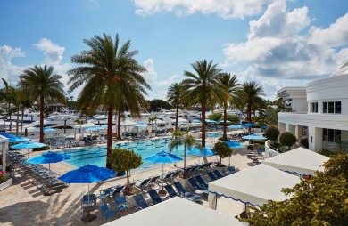 Experience the epitome of waterfront luxury in this first-floor on Jonathans Landing Golf Club in Florida - for sale on GolfHomes.com, golf home, golf lot