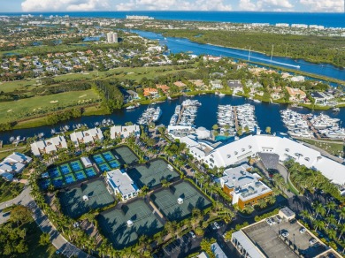 Experience the epitome of waterfront luxury in this first-floor on Jonathans Landing Golf Club in Florida - for sale on GolfHomes.com, golf home, golf lot