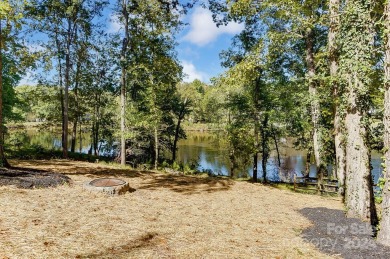 FANTASTIC CUL-DE-SAC LOCATION WITH BEAUTIFUL VIEWS OVERLOOKING on Raintree Country Club in North Carolina - for sale on GolfHomes.com, golf home, golf lot