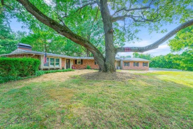 This is a must see updated 1950's ranch home. This 4 bedroom, 3 on Windridge Country Club in Kentucky - for sale on GolfHomes.com, golf home, golf lot