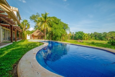 Experience luxury living in Puerto Aventuras with this beautiful on Club De Golf Puerto Aventuras in  - for sale on GolfHomes.com, golf home, golf lot