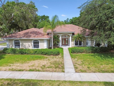 Stunning 4-bedroom, 3-bath pool home with spa on a serene pond on Crescent Oaks Country Club in Florida - for sale on GolfHomes.com, golf home, golf lot