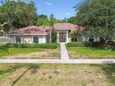 Stunning 4-bedroom, 3-bath pool home with spa on a serene pond on Crescent Oaks Country Club in Florida - for sale on GolfHomes.com, golf home, golf lot