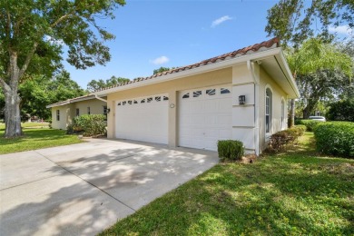 Stunning 4-bedroom, 3-bath pool home with spa on a serene pond on Crescent Oaks Country Club in Florida - for sale on GolfHomes.com, golf home, golf lot