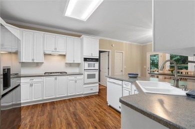 Welcome to this beautifully updated brick-front home offering a on Hamilton Mill Golf Club in Georgia - for sale on GolfHomes.com, golf home, golf lot