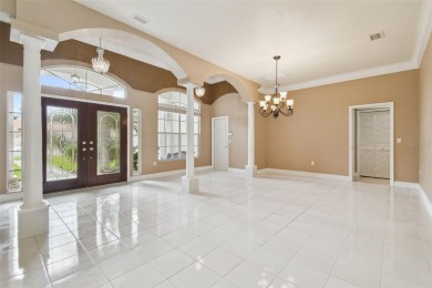 Stunning 4-bedroom, 3-bath pool home with spa on a serene pond on Crescent Oaks Country Club in Florida - for sale on GolfHomes.com, golf home, golf lot