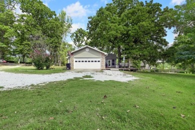 Enjoy a peaceful, park-like setting in this conveniently located on Harrison Country Club in Arkansas - for sale on GolfHomes.com, golf home, golf lot