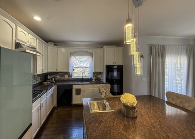 Largest River Bend end-unit townhome with 3 levels of living on River Bend Golf Club in Illinois - for sale on GolfHomes.com, golf home, golf lot