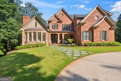 Privately tucked behind a long, tree-lined driveway and greeted on Chateau Elan Golf Club  in Georgia - for sale on GolfHomes.com, golf home, golf lot