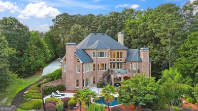 Privately tucked behind a long, tree-lined driveway and greeted on Chateau Elan Golf Club  in Georgia - for sale on GolfHomes.com, golf home, golf lot