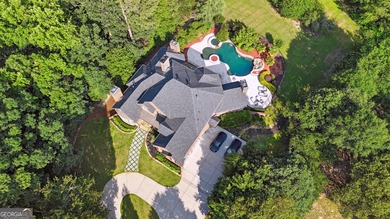 Privately tucked behind a long, tree-lined driveway and greeted on Chateau Elan Golf Club  in Georgia - for sale on GolfHomes.com, golf home, golf lot