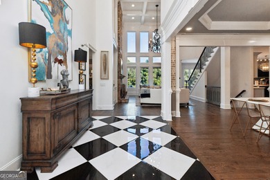 Privately tucked behind a long, tree-lined driveway and greeted on Chateau Elan Golf Club  in Georgia - for sale on GolfHomes.com, golf home, golf lot