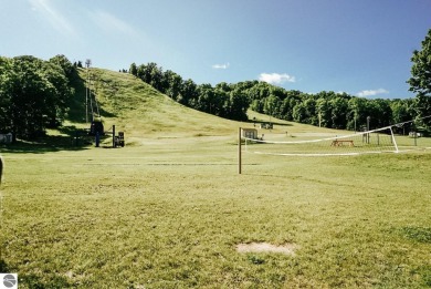 Welcome to an exceptional retreat at Schuss Mountain! This rare on Schuss Mountain Golf Club in Michigan - for sale on GolfHomes.com, golf home, golf lot