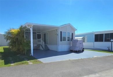 CHEERFUL, WELL-KEPT MOBILE HOME IN ACTIVE 55+ FLORIDA COMMUNITY! on River Run Golf Links in Florida - for sale on GolfHomes.com, golf home, golf lot