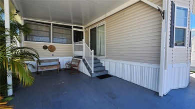 CHEERFUL, WELL-KEPT MOBILE HOME IN ACTIVE 55+ FLORIDA COMMUNITY! on River Run Golf Links in Florida - for sale on GolfHomes.com, golf home, golf lot