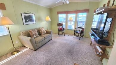 CHEERFUL, WELL-KEPT MOBILE HOME IN ACTIVE 55+ FLORIDA COMMUNITY! on River Run Golf Links in Florida - for sale on GolfHomes.com, golf home, golf lot