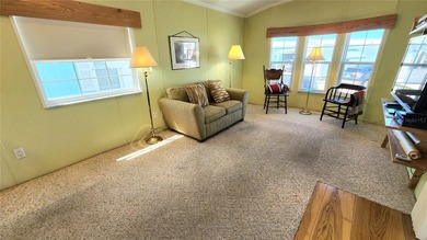 CHEERFUL, WELL-KEPT MOBILE HOME IN ACTIVE 55+ FLORIDA COMMUNITY! on River Run Golf Links in Florida - for sale on GolfHomes.com, golf home, golf lot