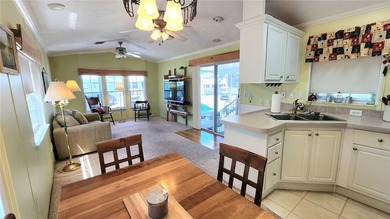 CHEERFUL, WELL-KEPT MOBILE HOME IN ACTIVE 55+ FLORIDA COMMUNITY! on River Run Golf Links in Florida - for sale on GolfHomes.com, golf home, golf lot