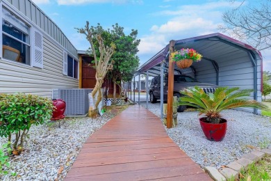 Fully Furnished 3BD 2BA manufactured home situated on one of the on Barefoot Resort and Golf Club  in South Carolina - for sale on GolfHomes.com, golf home, golf lot