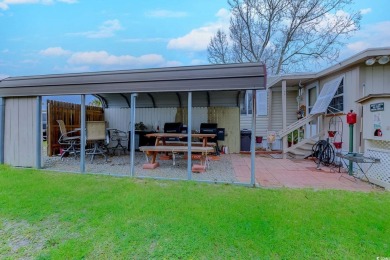 Fully Furnished 3BD 2BA manufactured home situated on one of the on Barefoot Resort and Golf Club  in South Carolina - for sale on GolfHomes.com, golf home, golf lot