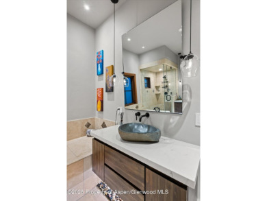 Impeccably updated and artfully crafted, this stunning River on River Valley Ranch Golf Club in Colorado - for sale on GolfHomes.com, golf home, golf lot