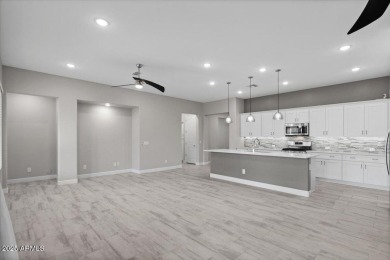 Experience luxury living in this impeccable 2-bedroom PLUS DEN on Tuscany Falls At Pebble Creek in Arizona - for sale on GolfHomes.com, golf home, golf lot