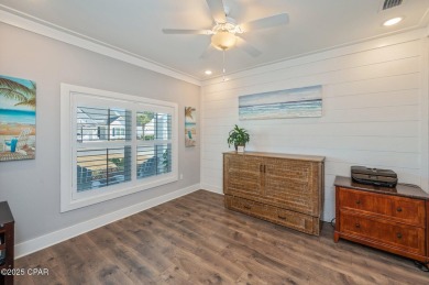 FULLY FURNISHED TURNKEY HOME WITH RELAXING COVERED OUTDOOR SPACE on Sharks Tooth Golf Club in Florida - for sale on GolfHomes.com, golf home, golf lot