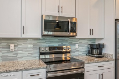 FULLY FURNISHED TURNKEY HOME WITH RELAXING COVERED OUTDOOR SPACE on Sharks Tooth Golf Club in Florida - for sale on GolfHomes.com, golf home, golf lot