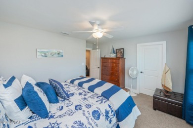 FULLY FURNISHED TURNKEY HOME WITH RELAXING COVERED OUTDOOR SPACE on Sharks Tooth Golf Club in Florida - for sale on GolfHomes.com, golf home, golf lot