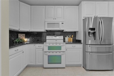 Welcome to this Exceptional EXPANDED LANTANA/BRADFORD MODEL on The Links of Spruce Creek in Florida - for sale on GolfHomes.com, golf home, golf lot