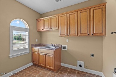 Welcome to this exquisite 3,500 sq ft residence nestled in the on Wedgewood Golfers Club in Mississippi - for sale on GolfHomes.com, golf home, golf lot