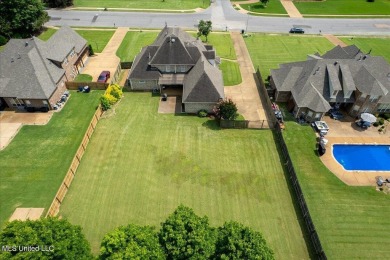 Welcome to this exquisite 3,500 sq ft residence nestled in the on Wedgewood Golfers Club in Mississippi - for sale on GolfHomes.com, golf home, golf lot