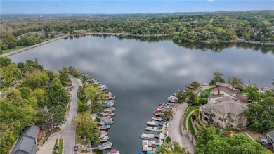Step inside this stunning lakefront home and just say *wow* on Lake Quivira Country Club in Kansas - for sale on GolfHomes.com, golf home, golf lot
