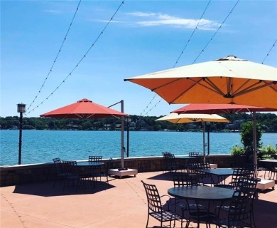 Step inside this stunning lakefront home and just say *wow* on Lake Quivira Country Club in Kansas - for sale on GolfHomes.com, golf home, golf lot