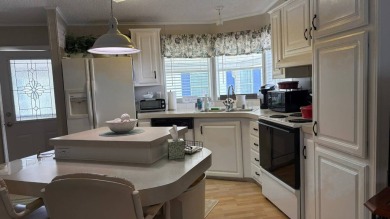 This quintessential Florida home is a perfect winter get-away or on Sabal Springs Golf and Racquet Club in Florida - for sale on GolfHomes.com, golf home, golf lot