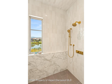 Just completed, this exceptional new home sits on a quiet pond on Aspen Glen Club in Colorado - for sale on GolfHomes.com, golf home, golf lot