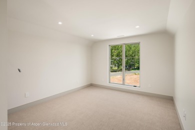 Just completed, this exceptional new home sits on a quiet pond on Aspen Glen Club in Colorado - for sale on GolfHomes.com, golf home, golf lot