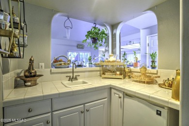 Discover luxurious living in this elegant 5-bedroom+den on El Conquistador Country Club - Conquistador in Arizona - for sale on GolfHomes.com, golf home, golf lot