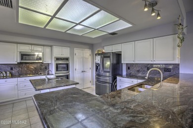 Discover luxurious living in this elegant 5-bedroom+den on El Conquistador Country Club - Conquistador in Arizona - for sale on GolfHomes.com, golf home, golf lot