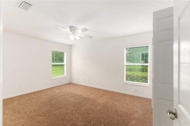 This Charming home is situated in the highly sought-after Gated on Miona Lake Golf Club in Florida - for sale on GolfHomes.com, golf home, golf lot