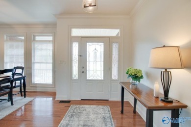Discover the charm of this custom home that overlooks the lake on Cherokee Ridge Country Club in Alabama - for sale on GolfHomes.com, golf home, golf lot
