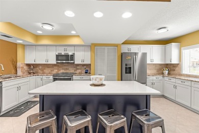 WHAT AN AMAZING HIGH END REMODEL WITH NOTHING  LEFT UNDONE on Bardmoor Golf and Tennis Club in Florida - for sale on GolfHomes.com, golf home, golf lot