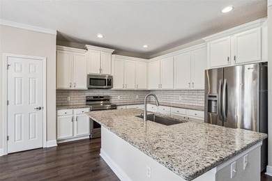 Located in the gated golf community of Eagle Creek, this move-in on Eagle Creek Golf Club in Florida - for sale on GolfHomes.com, golf home, golf lot