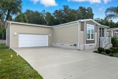Welcome home to this beautifully maintained Breezeway Cottage on Water Oak Country Club Estates in Florida - for sale on GolfHomes.com, golf home, golf lot
