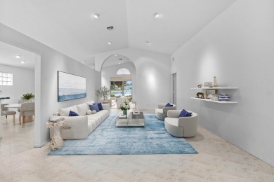 Lakefront single family home nestled amongst vibrant flowering on Westchester Golf and Country Club in Florida - for sale on GolfHomes.com, golf home, golf lot
