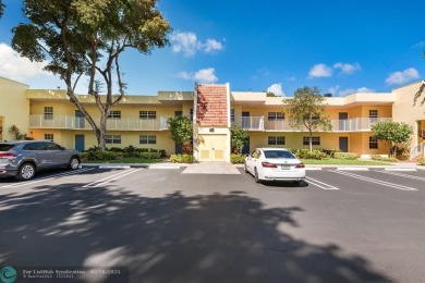 Light and bright! Move in condition 2/2 with peaceful green on Palm-Aire Country Club and Resort - Palms in Florida - for sale on GolfHomes.com, golf home, golf lot