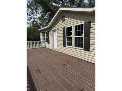 Recently moved to this lot, this beautifully 2015 manufactured on Wildwood Country Club in Florida - for sale on GolfHomes.com, golf home, golf lot