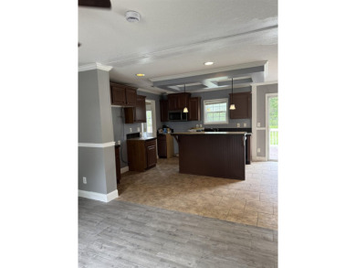 Recently moved to this lot, this beautifully 2015 manufactured on Wildwood Country Club in Florida - for sale on GolfHomes.com, golf home, golf lot